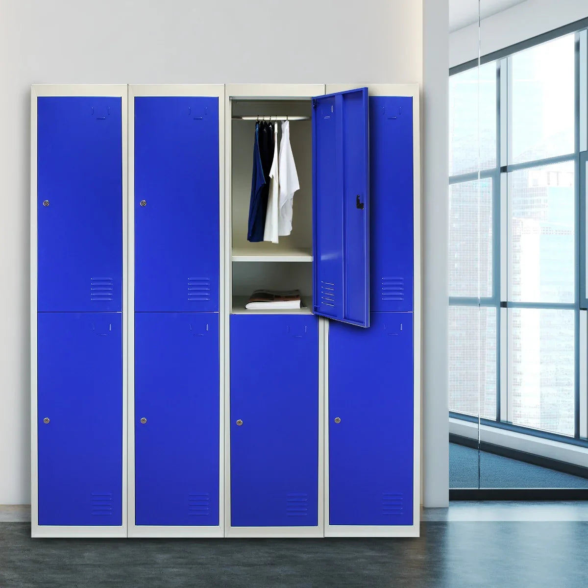 Blue metal storage lockers with two doors, featuring a flat-packed design and an open door displaying hanging clothes inside