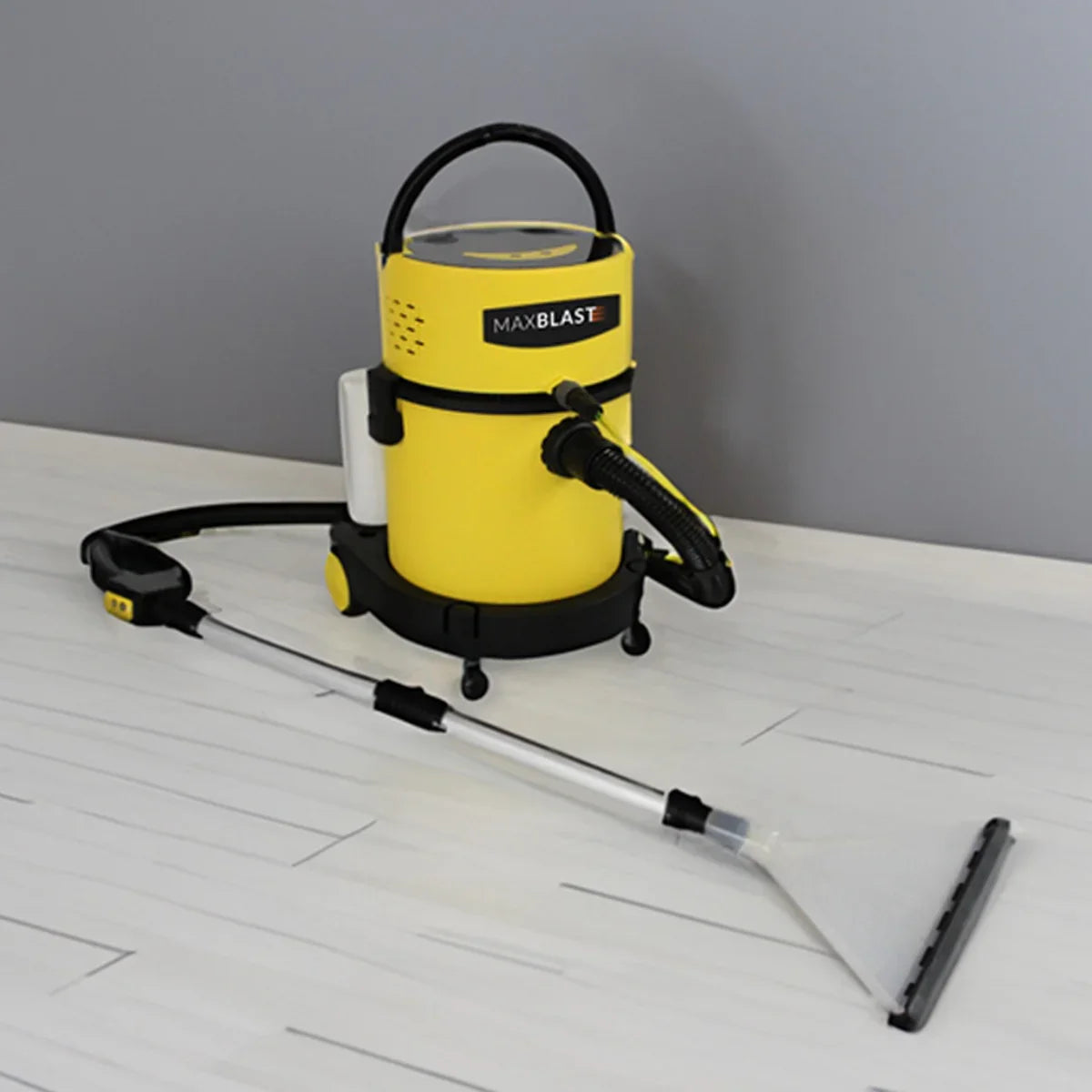 MAXBLAST Wet and Dry Vacuum Cleaner in bright yellow with a sleek design, featuring a hose and cleaning attachment on a white floor
