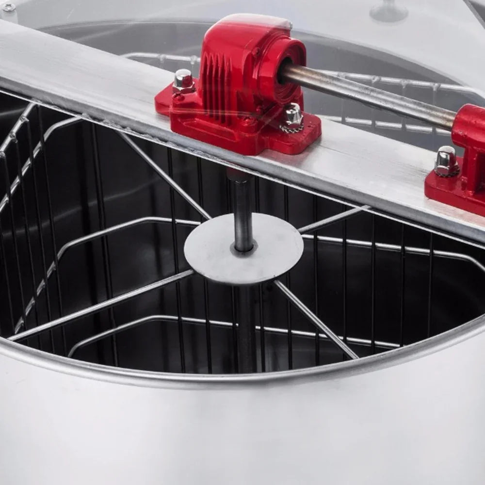 Manual honey extractor featuring a stainless steel drum, red metal gears, and a central spindle for efficient honey extraction