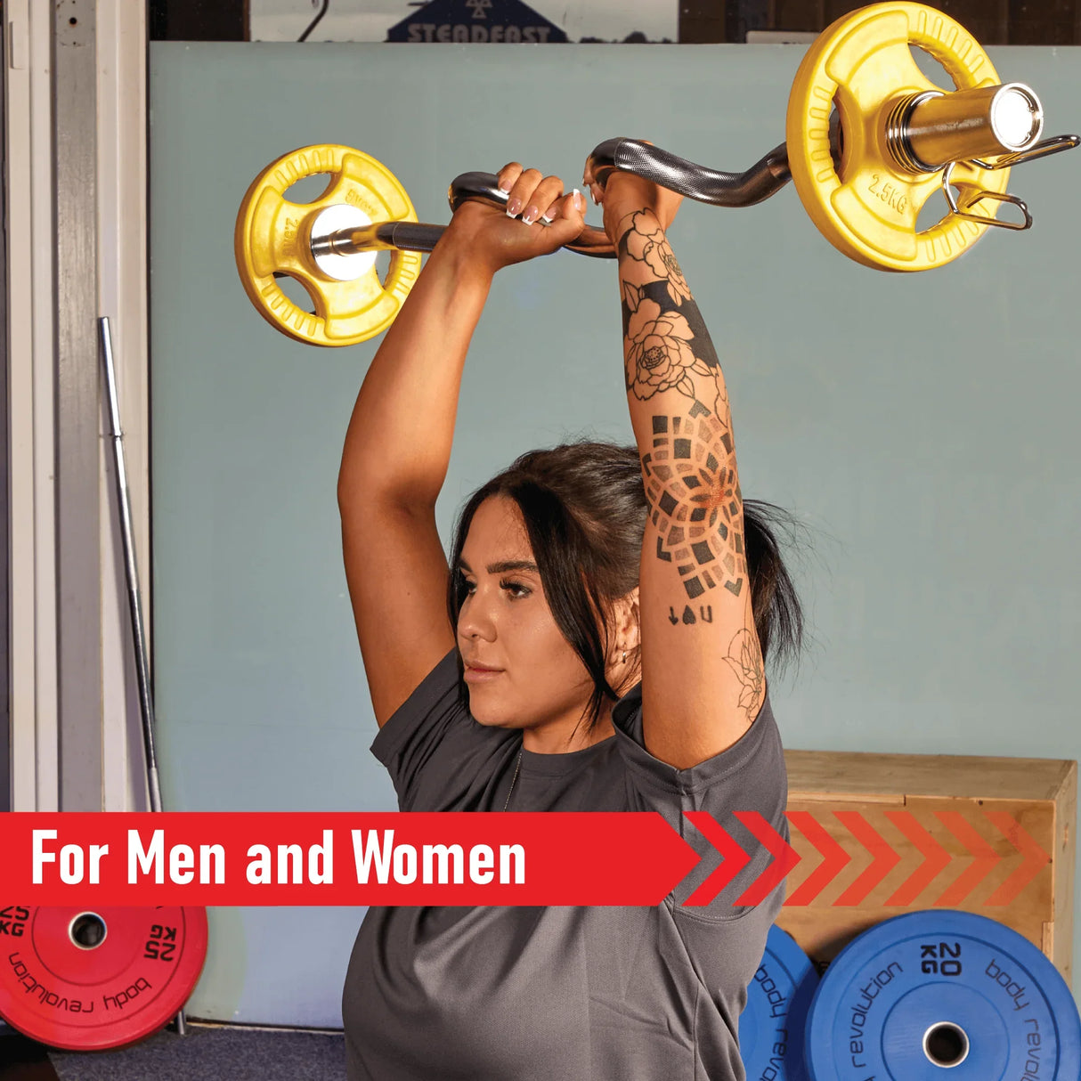 Olympic tri-grip rubber weight plates in vibrant yellow, held above a person’s head, showcasing strength training in a gym setting
