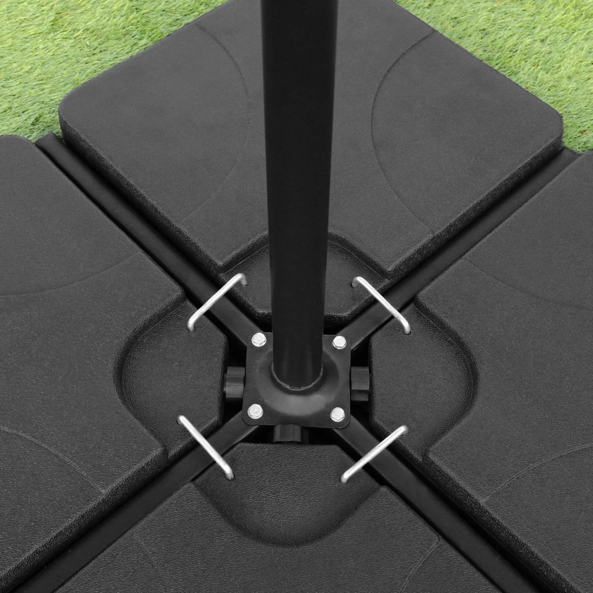 Beige cantilever parasol with a sturdy black square base, featuring a central pole and secure fastening for stability on grass
