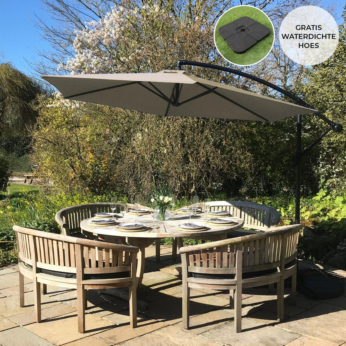 Beige cantilever parasol with a square base, providing shade over a circular dining table set in a lush garden setting
