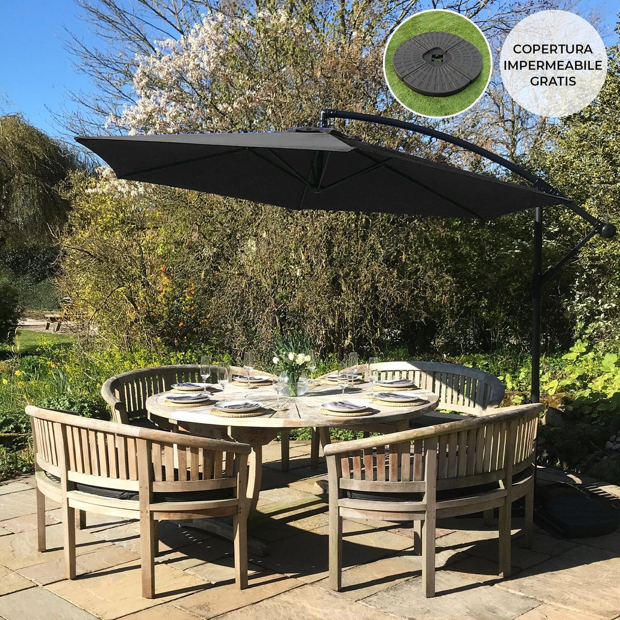 Black cantilever parasol with a sleek design and sturdy fan base, providing shade over a round dining table set in a garden
