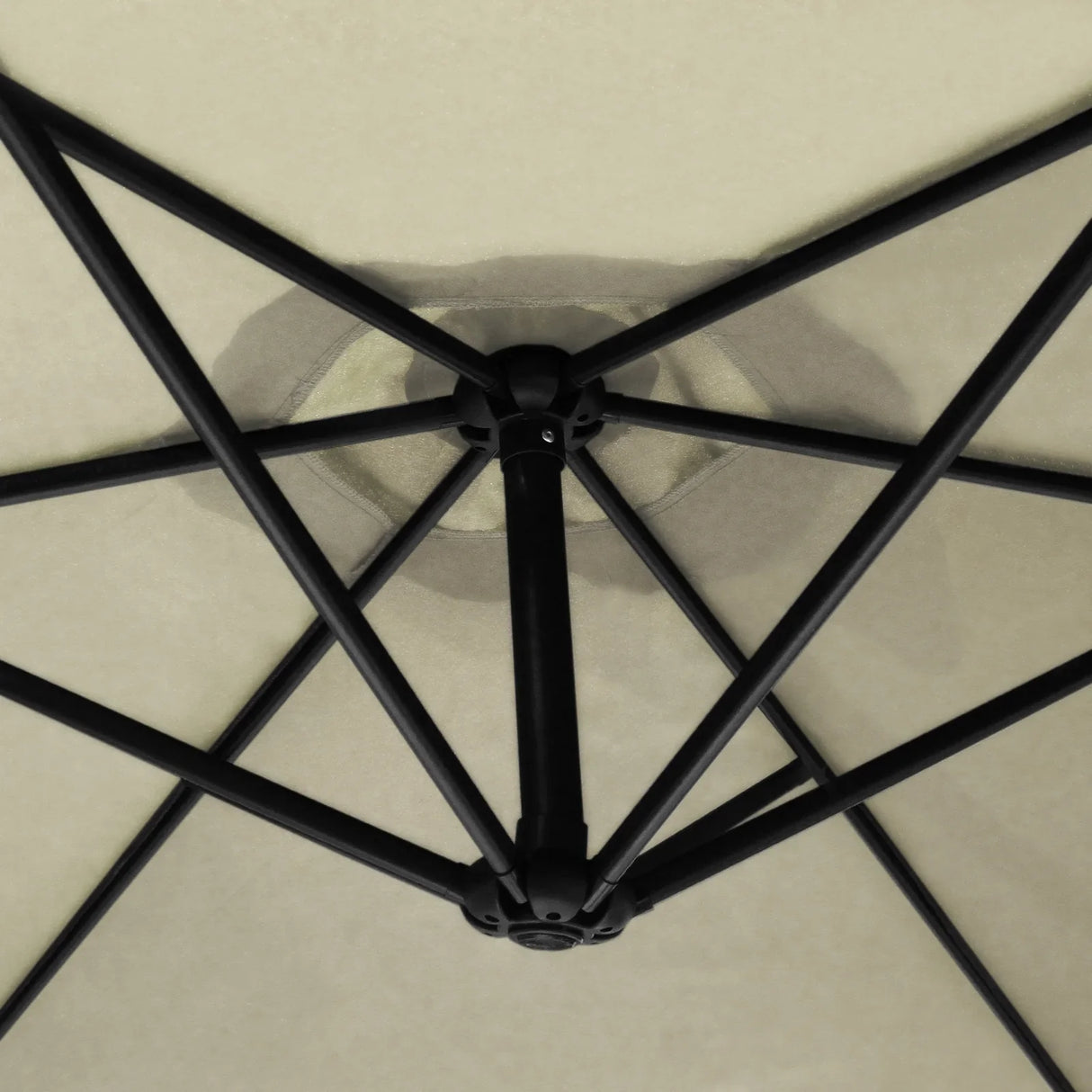 Cream cantilever parasol showcasing a sturdy black frame and a spacious, soft cream canopy with a unique geometric design