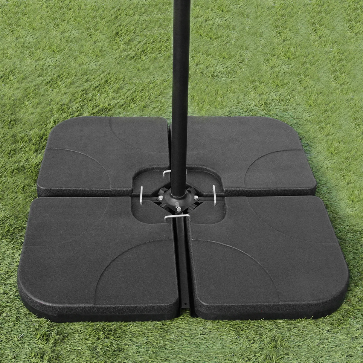 Cream cantilever parasol square base with four black heavy-duty slabs, designed for stability on grass surfaces