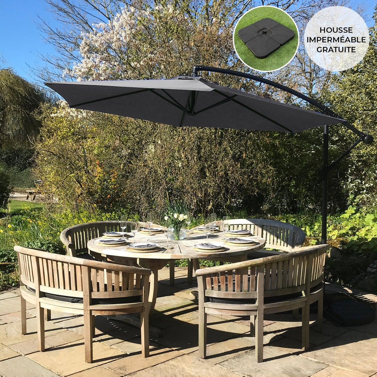 Grey cantilever parasol with a square base, featuring a sleek design and durable fabric, providing shade over a round dining table set outdoors