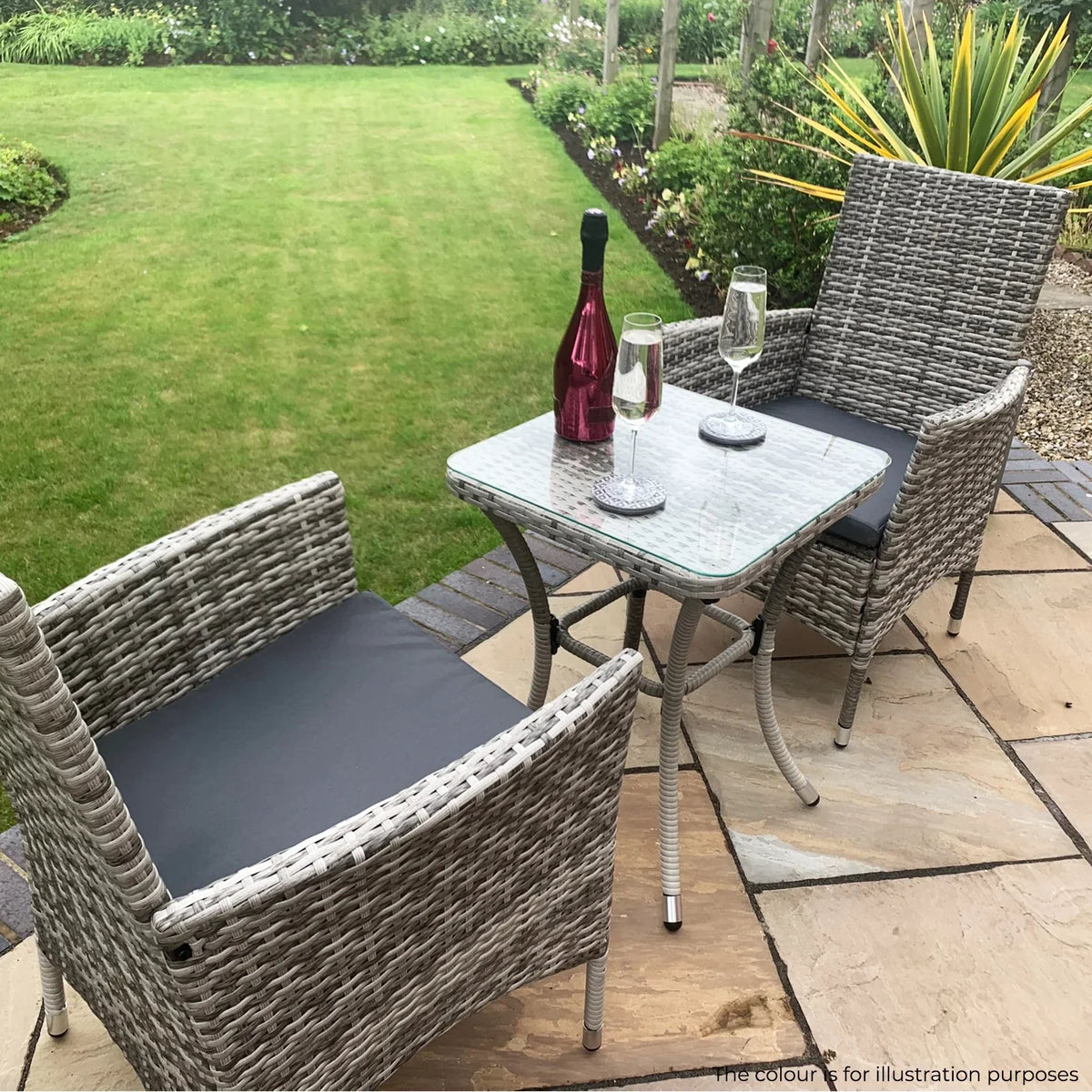 Light grey rattan bistro set featuring two chairs with cushions and a glass-top table, perfect for outdoor dining and relaxation