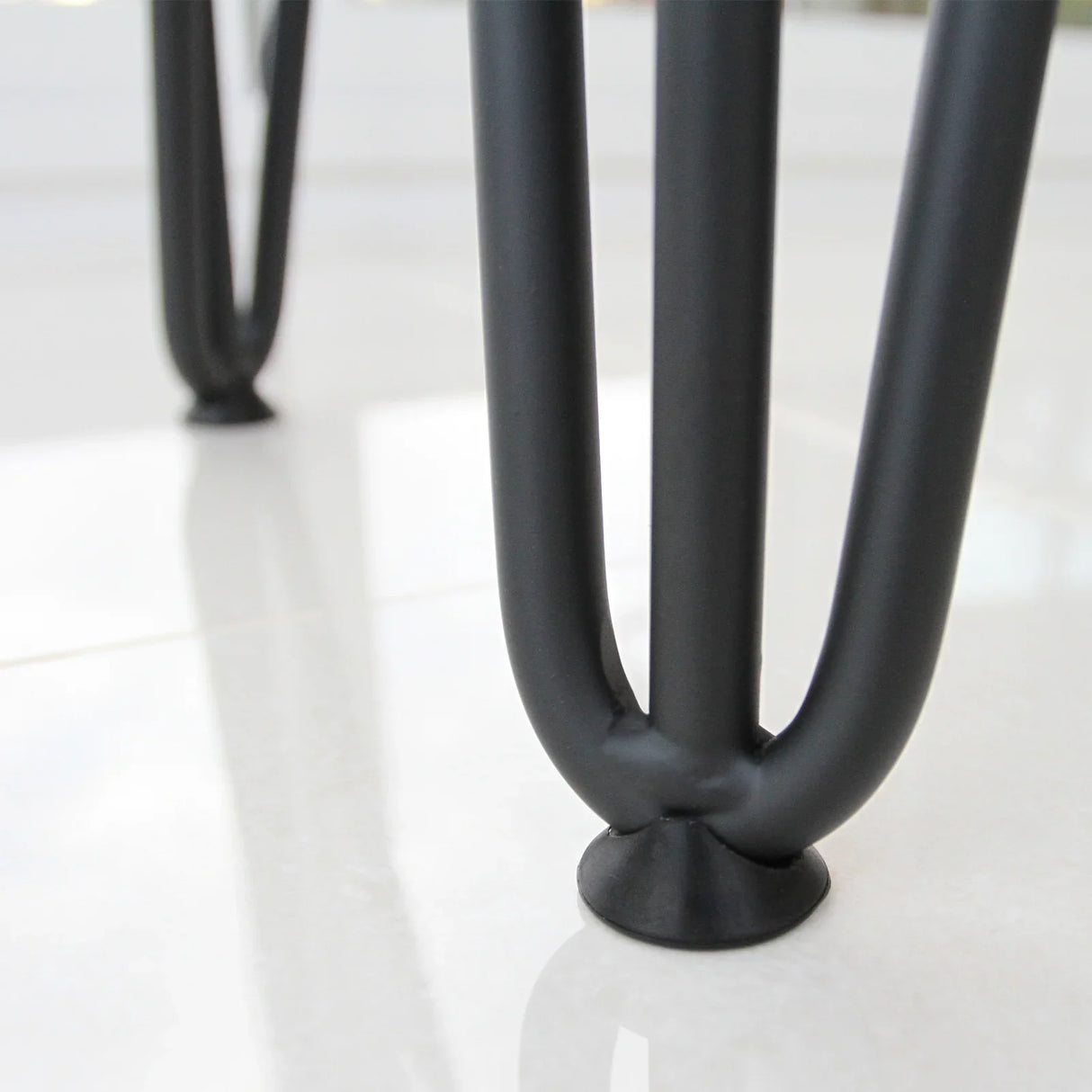 Black 12mm hairpin legs with a sleek, three-prong design, showcasing a smooth finish and sturdy base for furniture projects