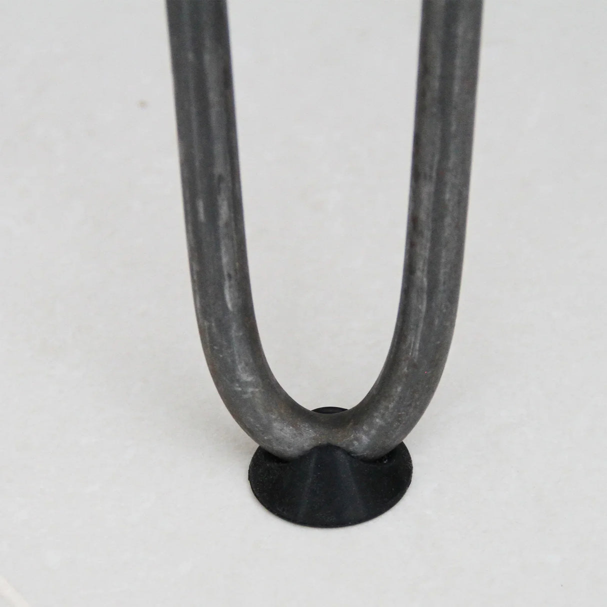 Raw steel hairpin leg with a 3-prong base, featuring a smooth finish and a sleek, minimalist design for furniture projects