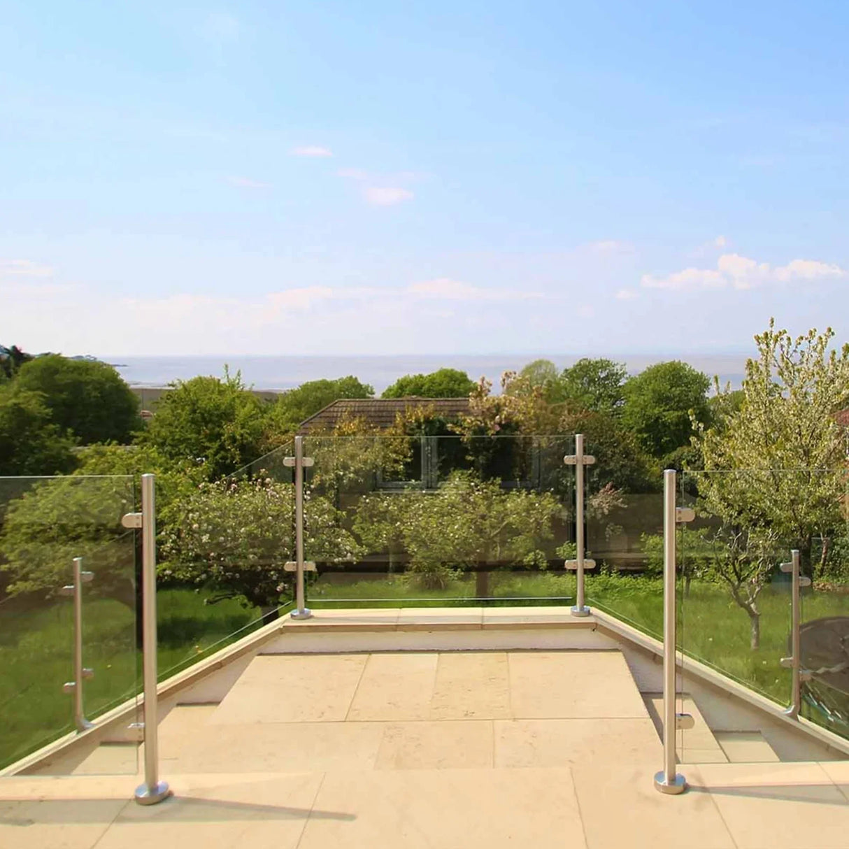 Stainless steel balustrade mid post, 110cm high, featuring sleek design, polished finish, and surrounded by a scenic outdoor view