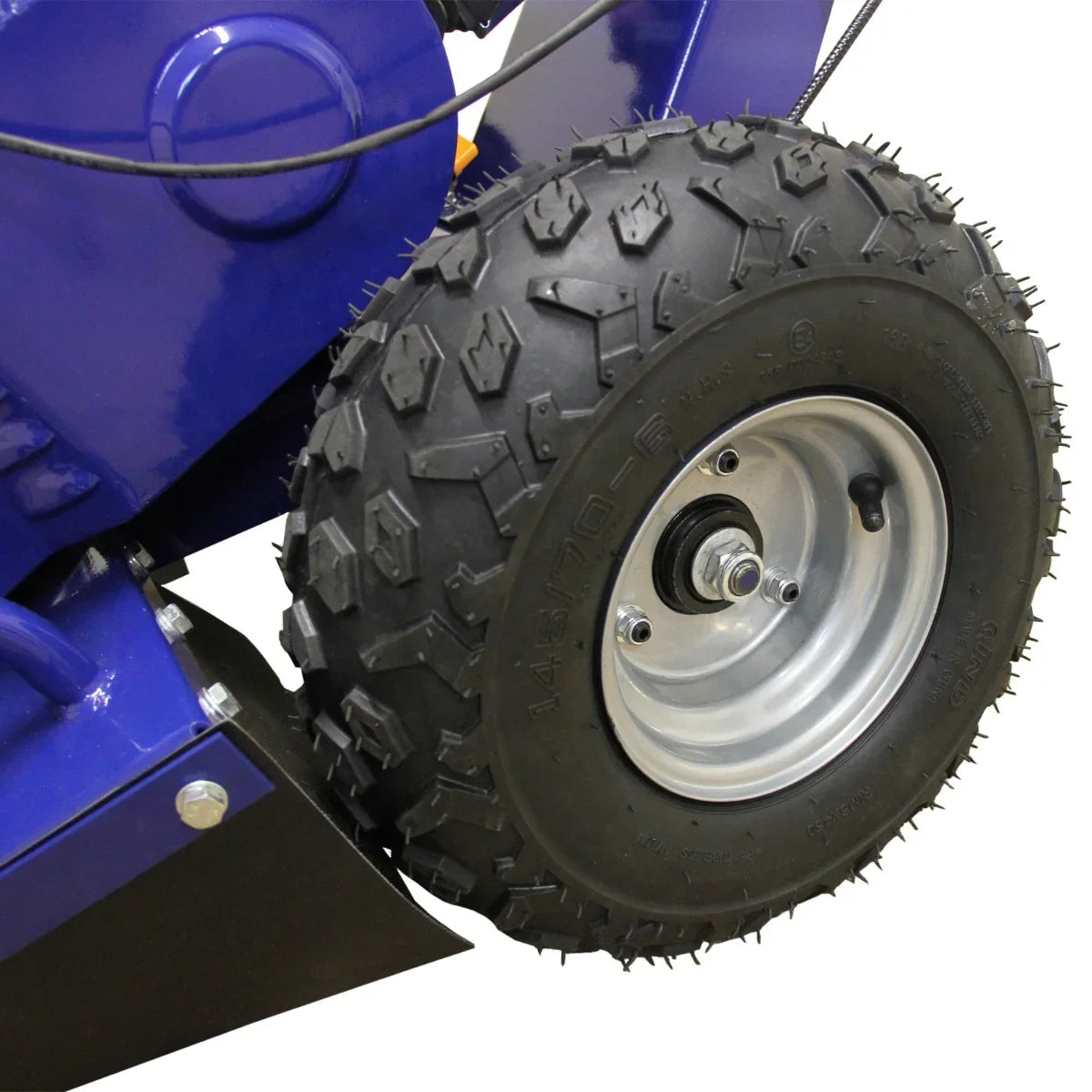 Close-up of the rugged tire on the T-Mech 15HP Stump Grinder, featuring deep treads for enhanced traction on various terrains