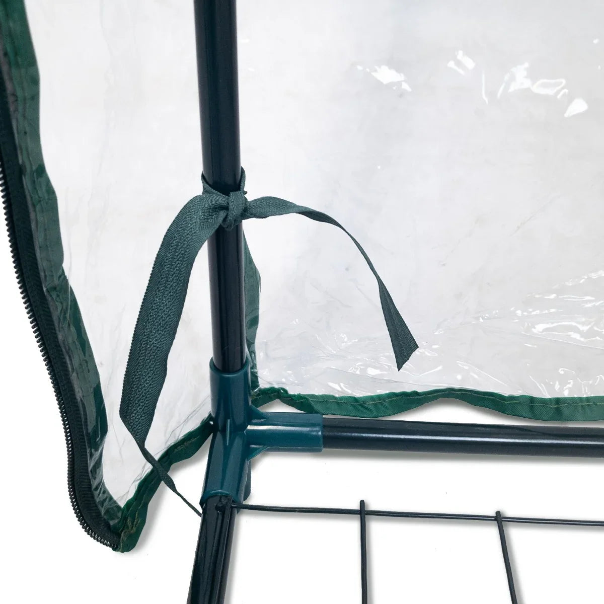 Close-up of the Mini Greenhouse 4 Tier with a clear plastic cover, featuring a green trim and tie for secure closure and stability