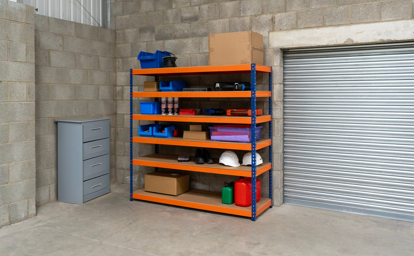 Heavy-duty orange metal shelving unit with five shelves, storing boxes, tools, and storage bins in a garage setting