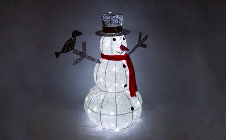 Festive illuminated snowman with a black top hat, red scarf, and silver bird, glowing softly against a dark background