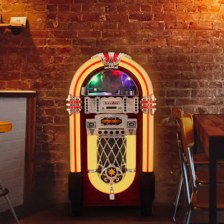 Vintage jukebox with vibrant red and yellow accents, intricate chrome details, and colorful lights, set against a rustic brick wall