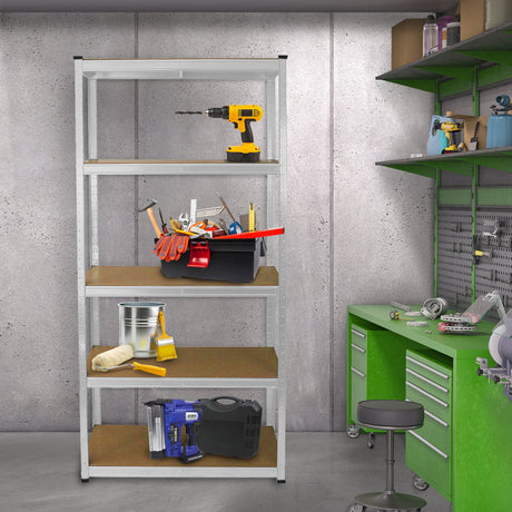Metal shelving unit with four wooden shelves, filled with tools, a bucket, and a drill, set against a concrete wall and green workbench