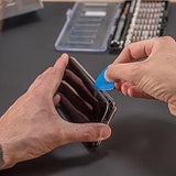 Hands using a blue plastic prying tool to open a smartphone, with a 90-piece precision screwdriver set in the background
