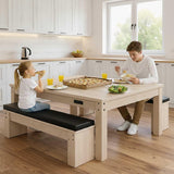 7-in-1 games table in oak finish with two black cushioned storage benches, featuring a family enjoying a meal together
