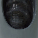 Sleek gray electric water feature with a smooth, rounded design and textured black water flow, creating a calming ambiance
