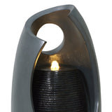Sleek gray electric water feature with a modern design, featuring a softly glowing light and textured water flow for tranquility