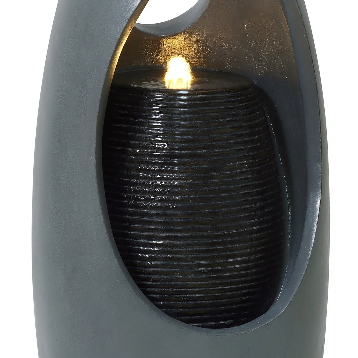 Sleek black electric water feature with a textured cylindrical fountain, softly illuminated by a warm glow, enhancing any space