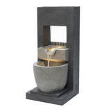 Sleek electric water feature with a modern design, featuring cascading water flowing from a stone-like structure into a round basin