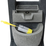 Gray electric water feature with a textured finish, featuring a built-in basin and a yellow cleaning brush resting inside