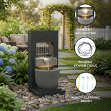 Stylish electric water feature with cascading water, ambient LED lighting, and a sleek black stone design, perfect for gardens