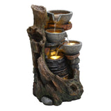 Rustic electric water feature with three stone bowls cascading water over textured bark and rocks, creating a serene ambiance