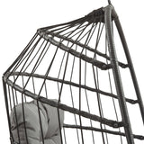 Black rattan hanging egg chair featuring a woven design, sturdy frame, and soft gray cushion for comfort and style