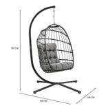 Stylish black rattan hanging egg chair with plush gray cushions, featuring a sturdy metal stand and modern design for indoor or outdoor use