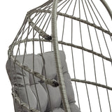 Stylish grey rattan hanging egg chair featuring a cushioned seat and intricate woven design, perfect for indoor or outdoor relaxation