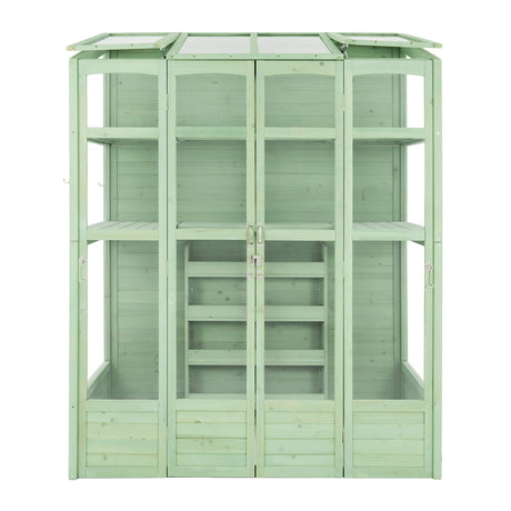 Victorian-style greenhouse in a soft green hue, featuring wooden panels, glass windows, and multiple shelves for plants