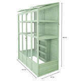Victorian-style greenhouse in soft green wood, featuring multiple shelves, large glass panels, and a spacious design for plants