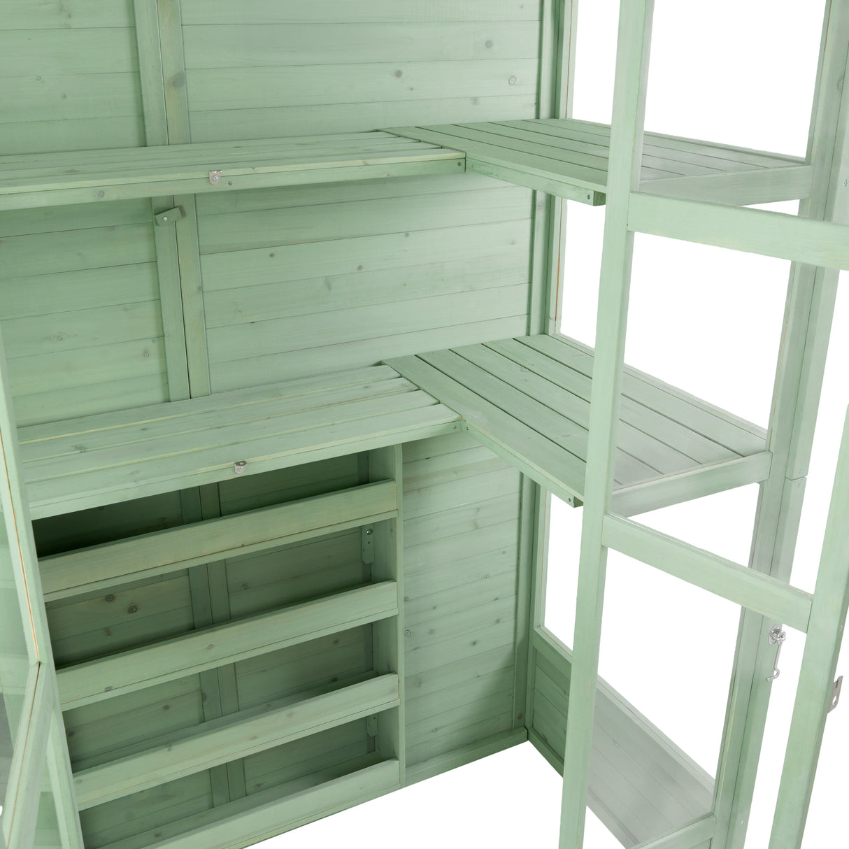 Victorian greenhouse in soft green wood, featuring multiple shelves and a spacious interior for plants and gardening supplies