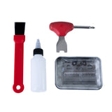 Cordless horse clippers in black with a red brush, oil bottle, screwdriver, and comb set for grooming and maintenance