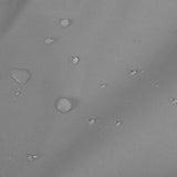 Water-resistant grey fabric of a large motorbike tent, featuring a textured surface with droplets of water for added durability