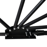 Sturdy black metal frame of a large motorbike tent, showcasing robust joints and a sleek, modern design for durability and stability