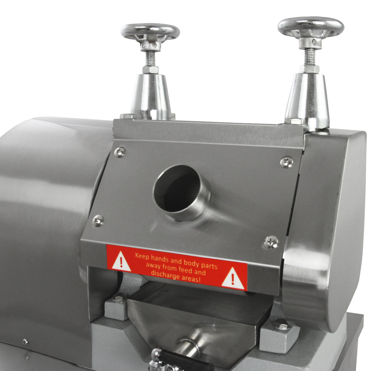 Stainless steel KuKoo sugar cane press with warning labels, featuring two adjustable handles and a circular feed opening for easy operation