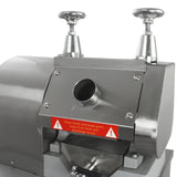 Stainless steel KuKoo sugar cane press with warning labels, featuring two adjustable handles and a circular feed opening for easy operation