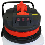 Top view of a 90L Maxblast industrial vacuum with a black and orange design, featuring control switches and a sturdy handle for easy transport