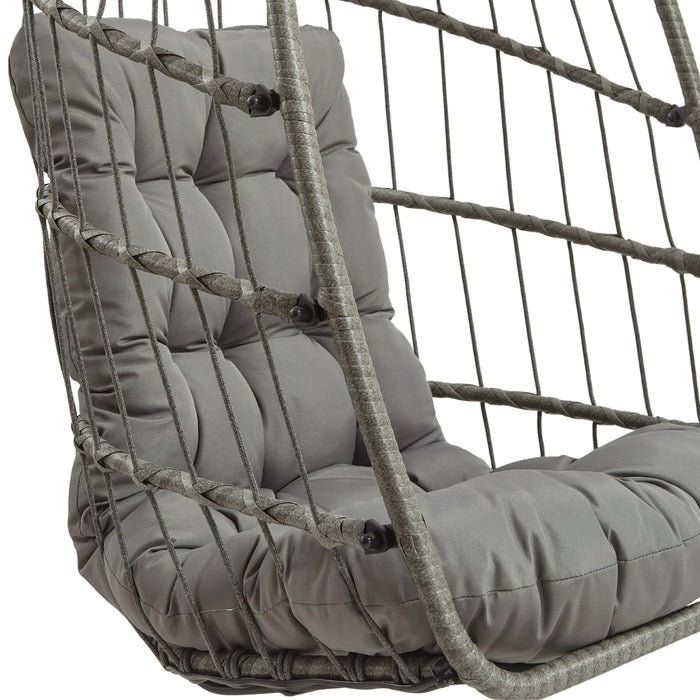 Cozy gray cushioned hanging chair with a woven rope frame, perfect for indoor or outdoor relaxation and stylish decor