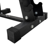 Sturdy black metal base of a dumbbell weight rack, featuring rubber feet for stability and visible bolts for secure assembly