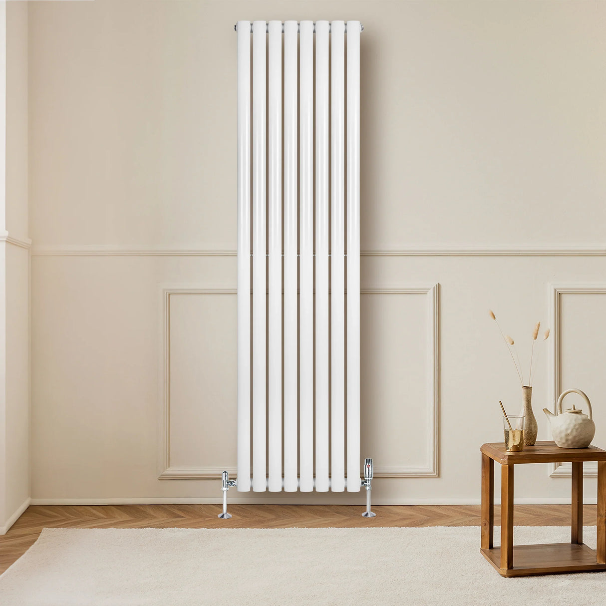 Sleek white oval single column radiator with valves, measuring 1800mm x 480mm, mounted on a light-colored wall in a modern room