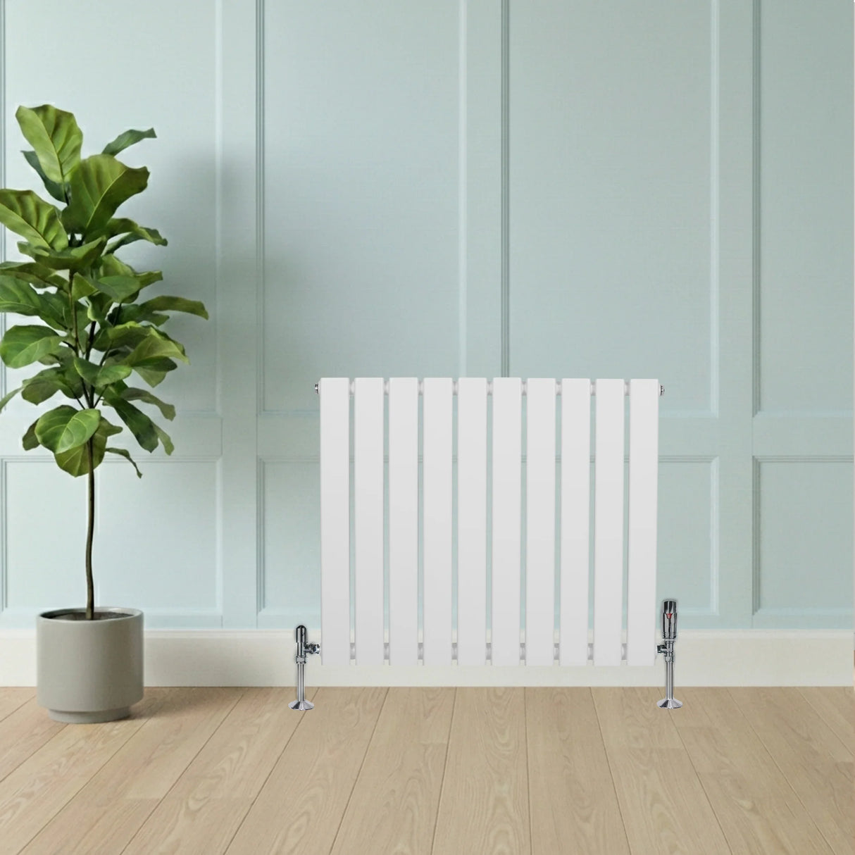 Flat single column radiator in white, 600mm x 700mm, featuring sleek vertical fins and chrome valves, set against a light wall and wooden floor