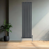 Flat single column radiator in anthracite grey, 1600mm x 420mm, featuring sleek vertical lines and chrome valves, set against a modern interior
