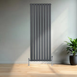 Flat single column radiator in anthracite grey, 1600mm x 560mm, featuring sleek vertical lines and chrome valves, set against a modern interior