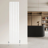 Flat white single column radiator with sleek vertical design and chrome valves, set against a modern interior backdrop