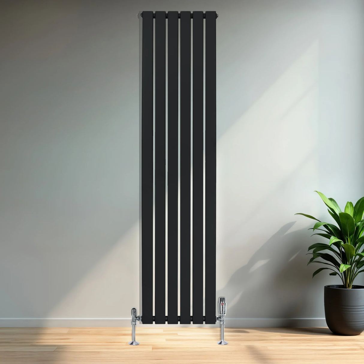 Sleek black flat single column radiator with vertical slats, measuring 1800mm x 420mm, complemented by stylish valves in a modern interior setting