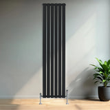 Sleek black flat single column radiator with vertical slats, measuring 1800mm x 420mm, complemented by stylish valves in a modern interior setting